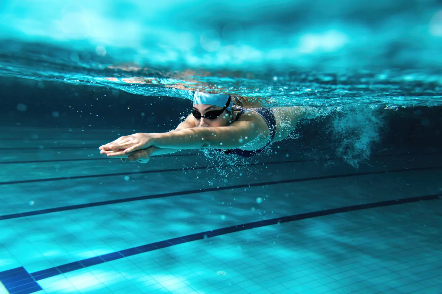A woman swimming under water
