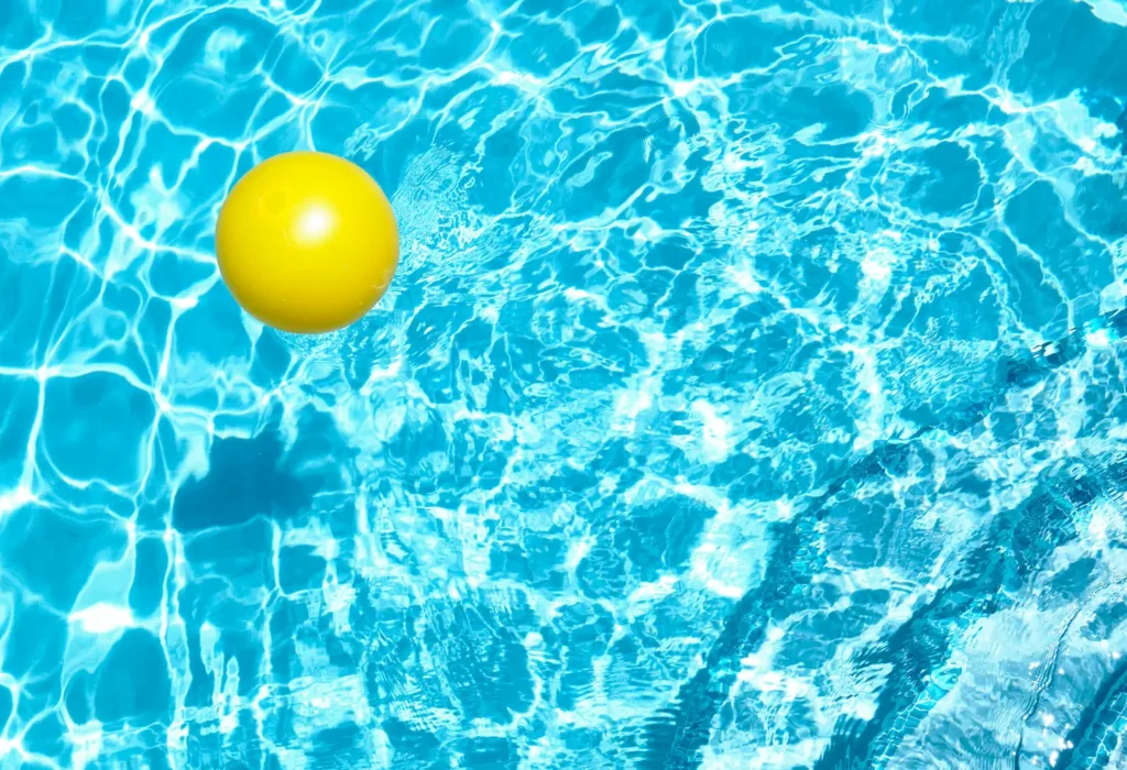 yellow ball floating in pool